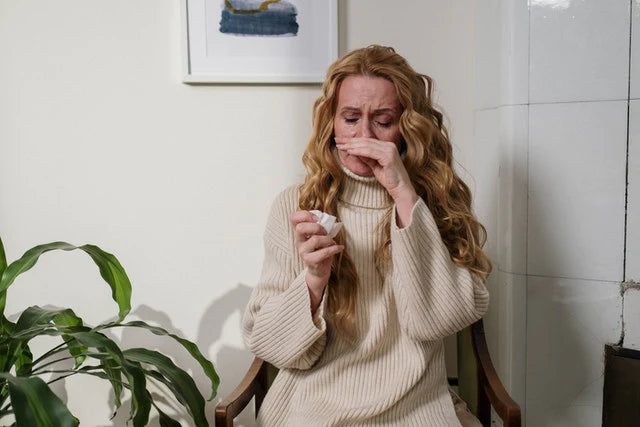 A woman suffering from allergies