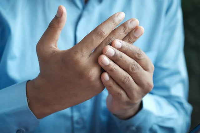 A person with joint pain in his hand
